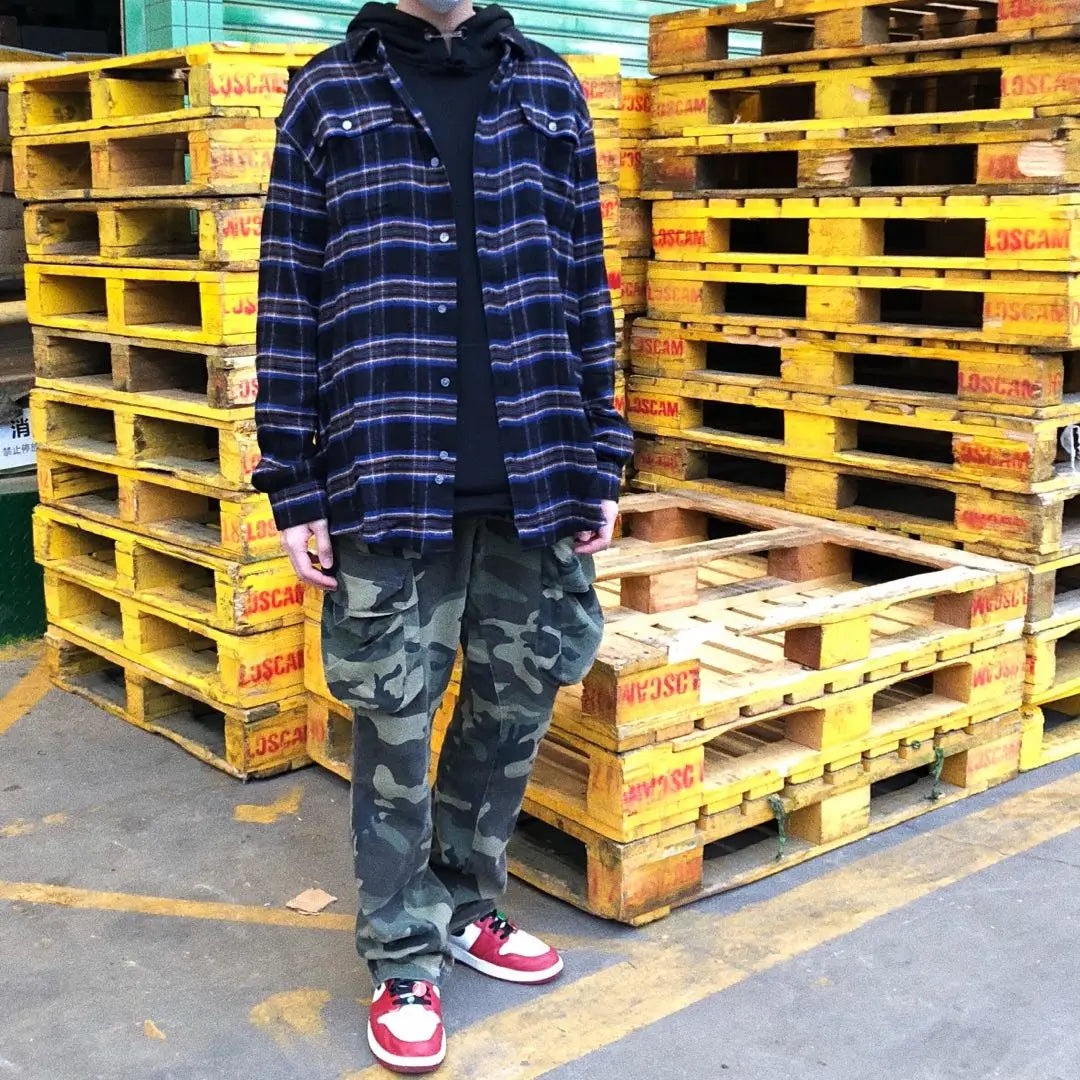 Distressed camouflage overalls