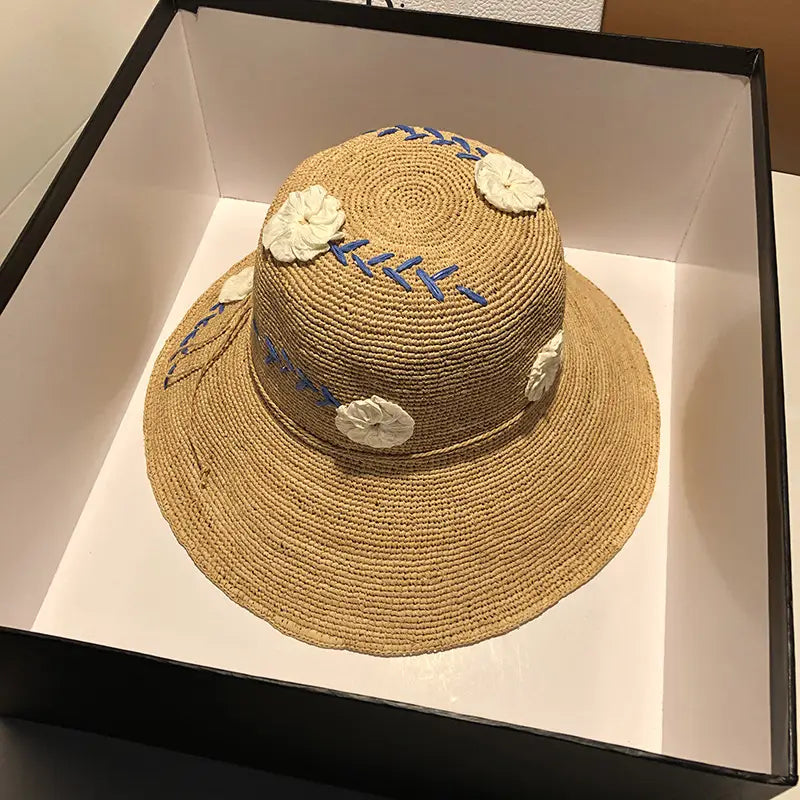 Women’s Raffia Hat With Embroidered Flowers On Vacation By The Sea