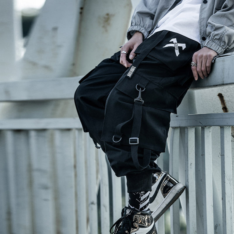 Black cargo pants with straps from 11bbsdusk national tide overalls for a stylish look