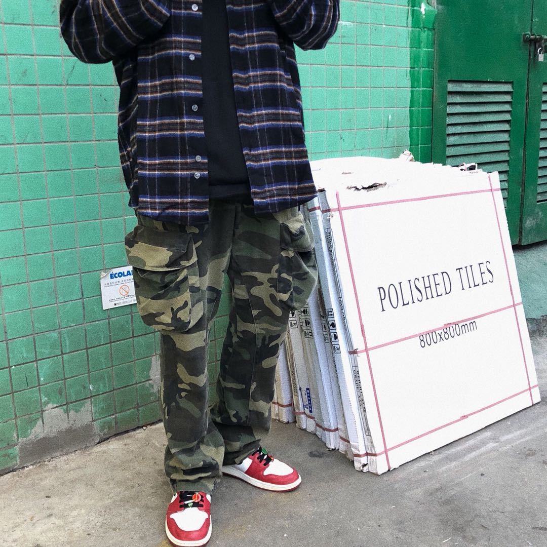 Distressed camouflage overalls