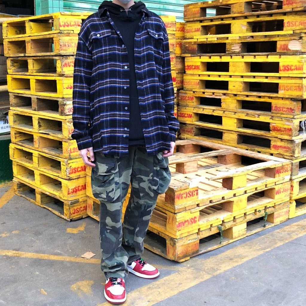Distressed camouflage overalls