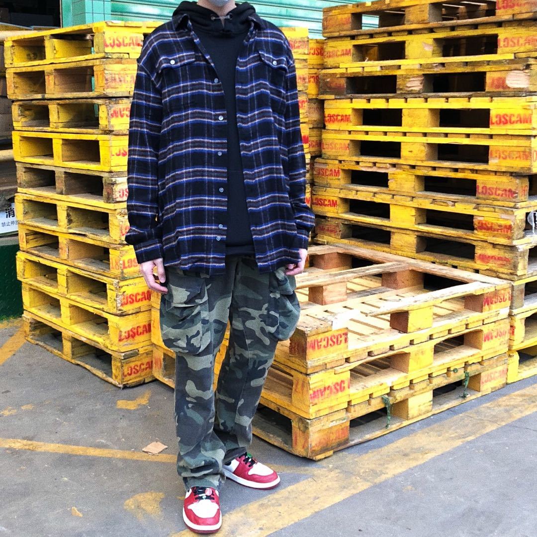 Distressed camouflage overalls