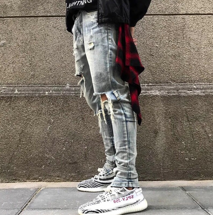 Washed holes in jeans men and women GRE hip hop street trend stars with the same paragraph
