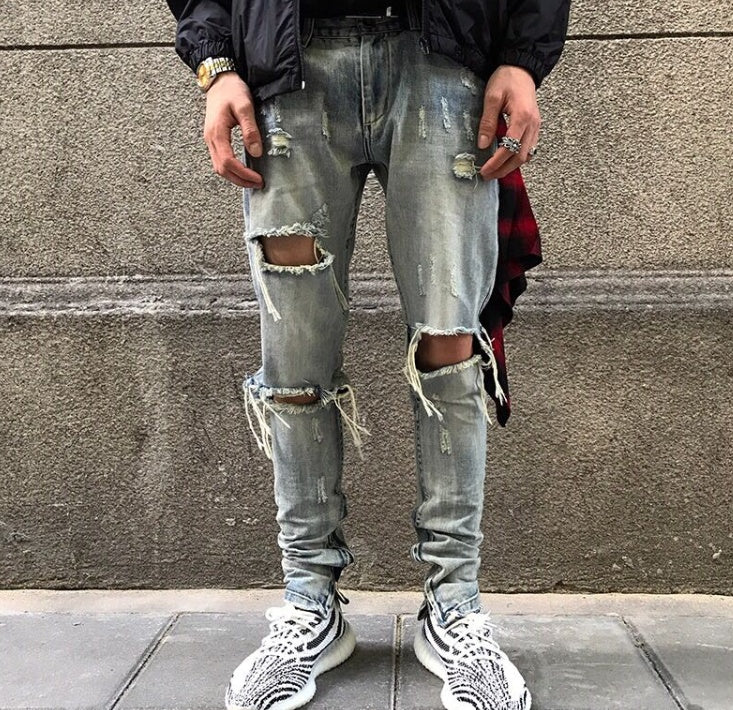 Washed holes in jeans men and women GRE hip hop street trend stars with the same paragraph