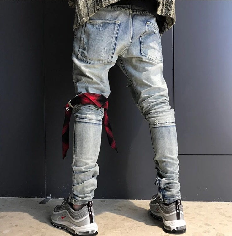 Washed holes in jeans men and women GRE hip hop street trend stars with the same paragraph